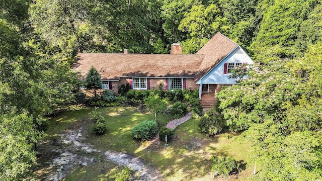 4920 Meadow St, Loris, SC 29569 - view of front of property featuring a chimney, brick siding, and a wooded view
