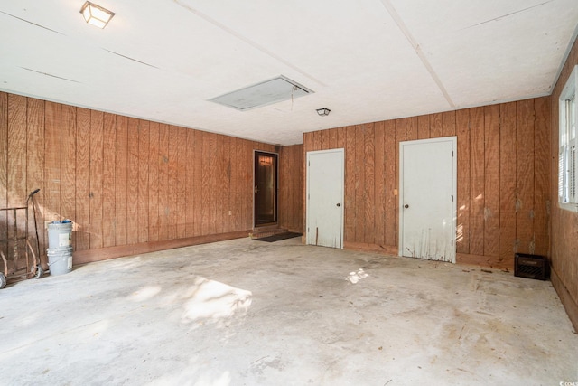 4920 Meadow St, Loris, SC 29569 - spare room with wood walls and concrete flooring