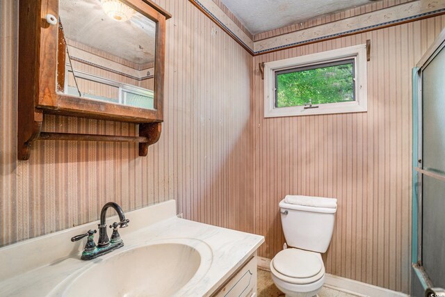 4920 Meadow St, Loris, SC 29569 - full bathroom with vanity, a shower with shower door, wallpapered walls, and a textured ceiling