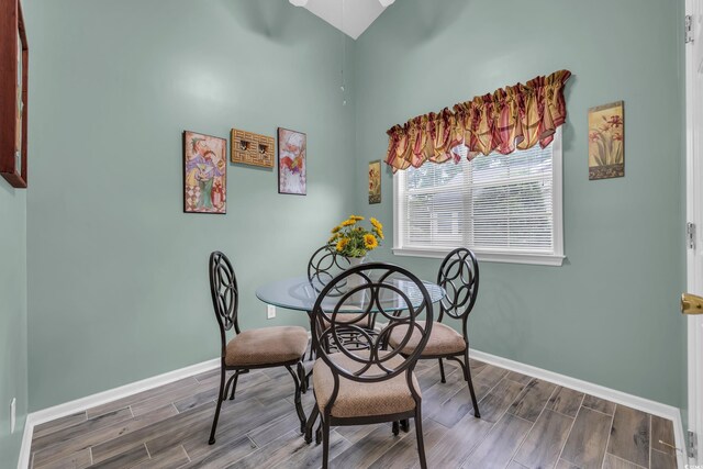 1206 Formby Ct, Myrtle Beach, SC 29588 - dining room featuring wood tiled floors, high vaulted ceiling, and ceiling fan