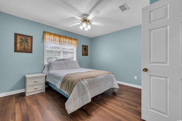 1206 Formby Ct, Myrtle Beach, SC 29588 - bedroom featuring dark wood-type flooring, a textured ceiling, and ceiling fan