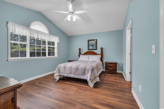 1206 Formby Ct, Myrtle Beach, SC 29588 - bedroom featuring lofted ceiling, wood finished floors, a ceiling fan, and a textured ceiling