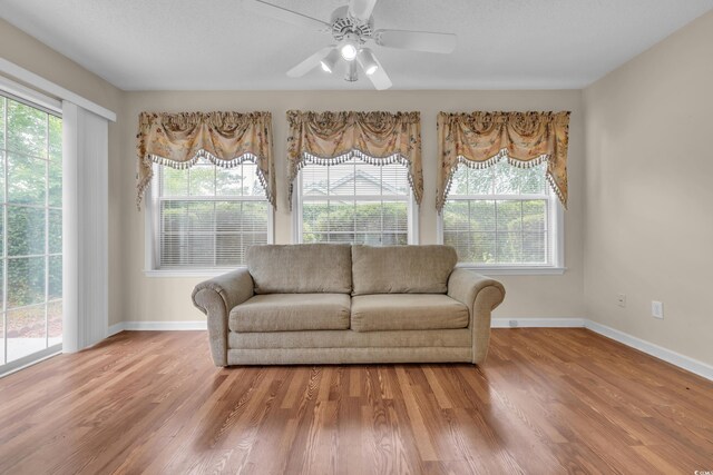 1206 Formby Ct, Myrtle Beach, SC 29588 - living area featuring healthy amount of natural light, wood finished floors, and a ceiling fan