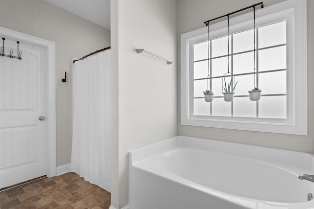 3617 Pasture Rd, Aynor, SC 29511 - bathroom with a bath and stone finish floors