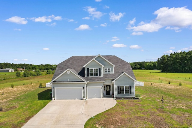 3617 Pasture Rd, Aynor, SC 29511 - traditional-style house with driveway, a front lawn, roof with shingles, and an attached garage