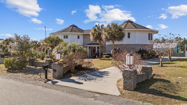 4552 River Rd, Little River, SC 29566 - view of front facade with a front lawn
