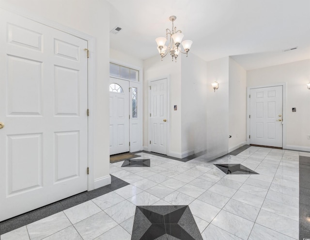 4552 River Rd, Little River, SC 29566 - entryway featuring a chandelier and baseboards