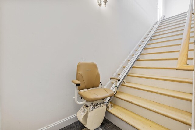 4552 River Rd, Little River, SC 29566 - stairway featuring baseboards