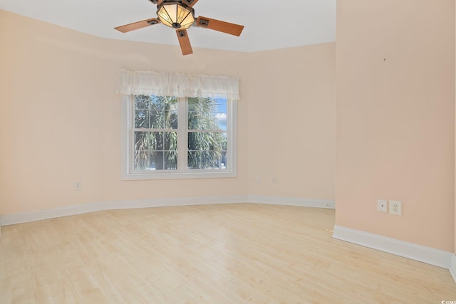 4552 River Rd, Little River, SC 29566 - empty room with wood finished floors and ceiling fan