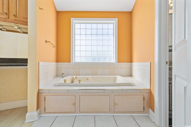 4552 River Rd, Little River, SC 29566 - bathroom with a jetted tub and tile patterned flooring
