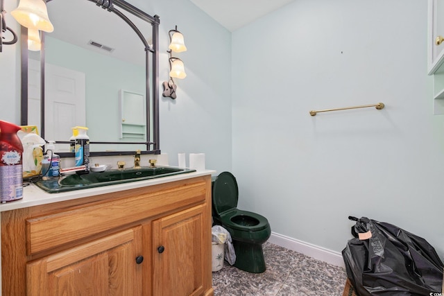 4552 River Rd, Little River, SC 29566 - bathroom featuring toilet and vanity