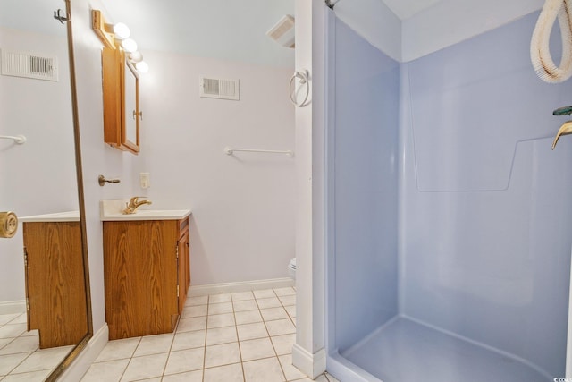 4552 River Rd, Little River, SC 29566 - bathroom featuring vanity, a stall shower, and tile patterned flooring