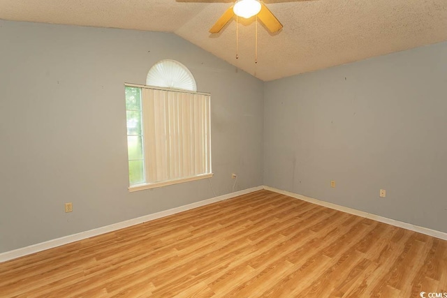 318 Muirfield Rd, Myrtle Beach, SC 29588 - spare room with light wood-type flooring, vaulted ceiling, a textured ceiling, and ceiling fan