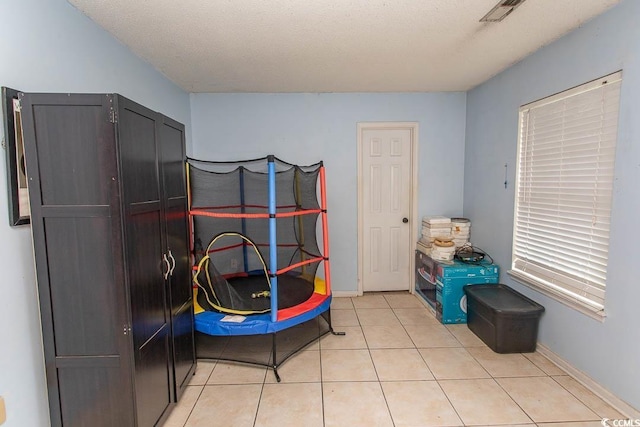 318 Muirfield Rd, Myrtle Beach, SC 29588 - bedroom with light tile patterned floors