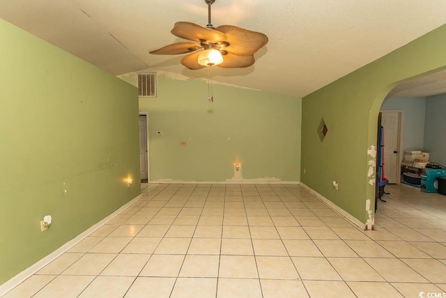 318 Muirfield Rd, Myrtle Beach, SC 29588 - empty room featuring a ceiling fan, vaulted ceiling, arched walkways, and light tile patterned flooring