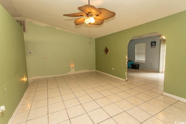 318 Muirfield Rd, Myrtle Beach, SC 29588 - unfurnished room featuring arched walkways, a ceiling fan, light tile patterned floors, and vaulted ceiling