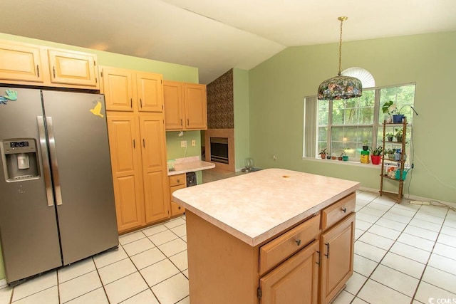 318 Muirfield Rd, Myrtle Beach, SC 29588 - kitchen with stainless steel fridge with ice dispenser, lofted ceiling, light countertops, light tile patterned flooring, and a kitchen island