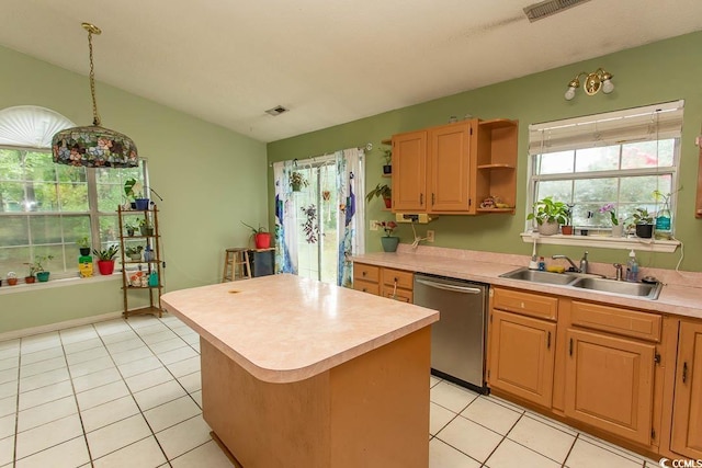318 Muirfield Rd, Myrtle Beach, SC 29588 - kitchen with dishwasher, light countertops, a center island, lofted ceiling, and light tile patterned flooring