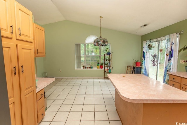 318 Muirfield Rd, Myrtle Beach, SC 29588 - kitchen featuring light countertops, vaulted ceiling, a center island, light brown cabinetry, and light tile patterned floors