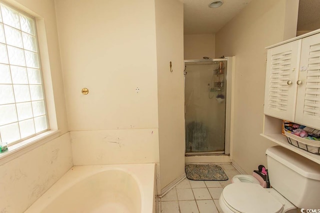 318 Muirfield Rd, Myrtle Beach, SC 29588 - full bathroom featuring a bath, healthy amount of natural light, a shower stall, and tile patterned flooring