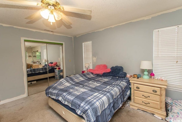 318 Muirfield Rd, Myrtle Beach, SC 29588 - bedroom with light carpet, a closet, a textured ceiling, a ceiling fan, and crown molding