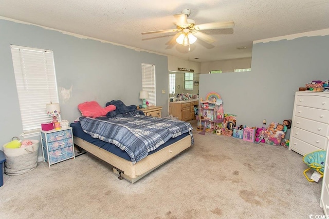 318 Muirfield Rd, Myrtle Beach, SC 29588 - bedroom with carpet, a textured ceiling, a ceiling fan, and ensuite bath