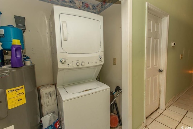 318 Muirfield Rd, Myrtle Beach, SC 29588 - washroom featuring stacked washer and clothes dryer, light tile patterned floors, and water heater