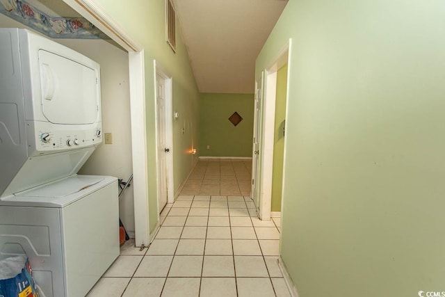 318 Muirfield Rd, Myrtle Beach, SC 29588 - laundry room with stacked washing machine and dryer and light tile patterned floors