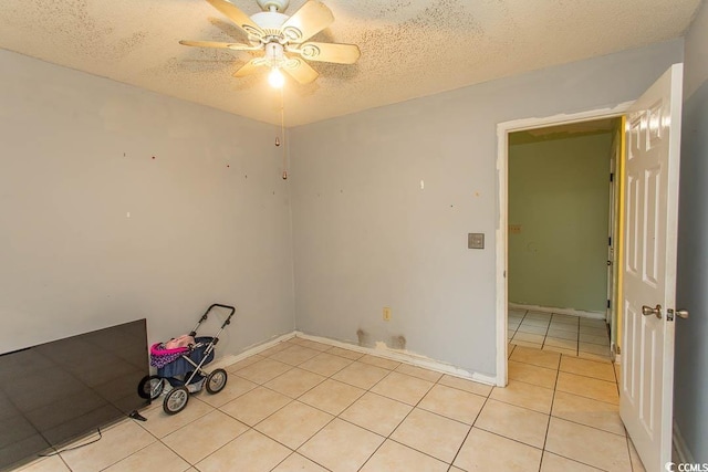 318 Muirfield Rd, Myrtle Beach, SC 29588 - unfurnished room with light tile patterned floors, a textured ceiling, and a ceiling fan