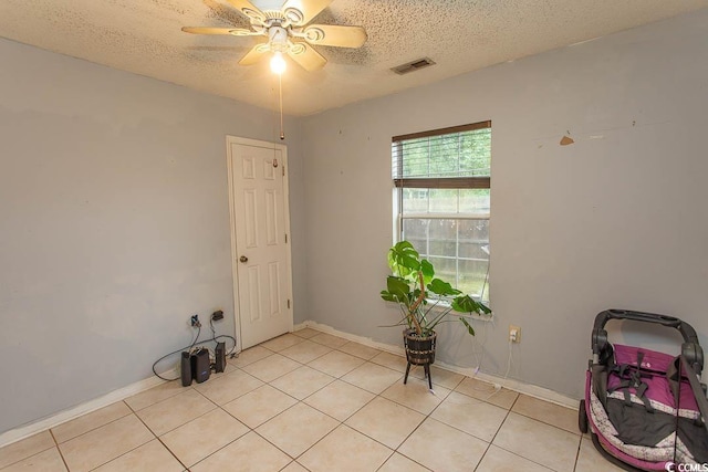 318 Muirfield Rd, Myrtle Beach, SC 29588 - unfurnished room featuring ceiling fan, light tile patterned floors, and a textured ceiling
