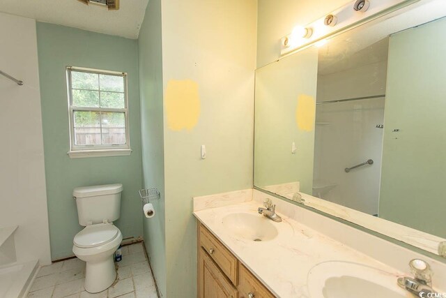 318 Muirfield Rd, Myrtle Beach, SC 29588 - bathroom featuring double vanity and a shower