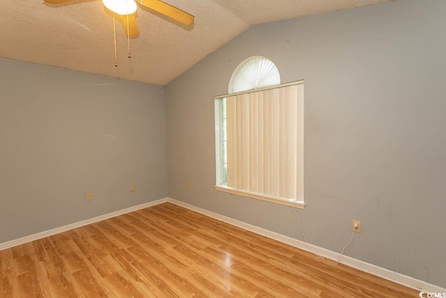 318 Muirfield Rd, Myrtle Beach, SC 29588 - spare room with light wood-style flooring, a textured ceiling, vaulted ceiling, and a ceiling fan