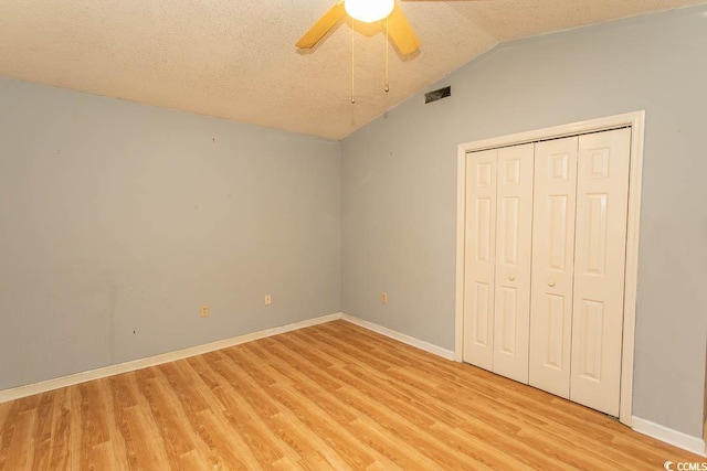 318 Muirfield Rd, Myrtle Beach, SC 29588 - unfurnished bedroom with light wood-type flooring, vaulted ceiling, a textured ceiling, a closet, and ceiling fan