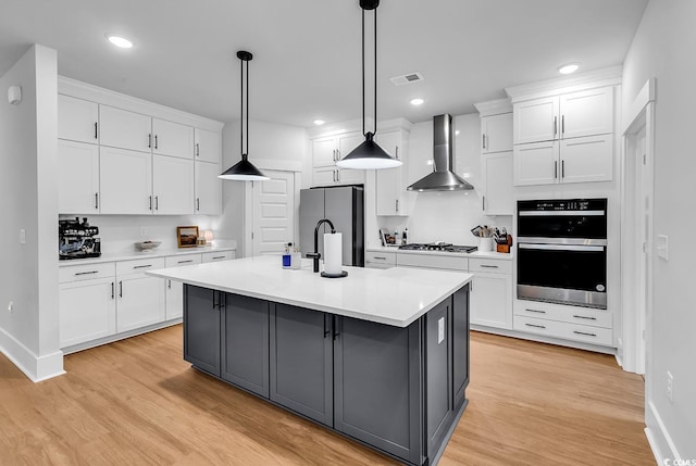1216 Newell Dr, Myrtle Beach, SC 29588 - kitchen featuring wall chimney range hood, freestanding refrigerator, double oven, white cabinetry, and recessed lighting