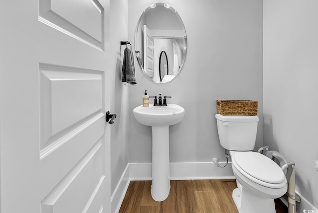 1216 Newell Dr, Myrtle Beach, SC 29588 - half bathroom with toilet and wood finished floors