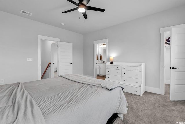 1216 Newell Dr, Myrtle Beach, SC 29588 - carpeted bedroom featuring a walk in closet, connected bathroom, and ceiling fan