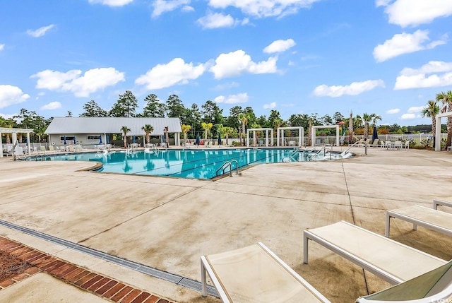 1216 Newell Dr, Myrtle Beach, SC 29588 - community pool featuring a patio area