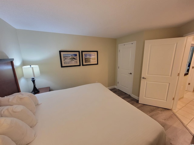 201 S Ocean Blvd Unit 205, Myrtle Beach, SC 29577 - bedroom featuring baseboards and wood finished floors