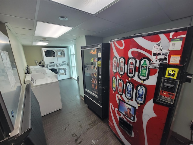 201 S Ocean Blvd Unit 205, Myrtle Beach, SC 29577 - interior space with stacked washer / drying machine, a paneled ceiling, and dark wood-style flooring