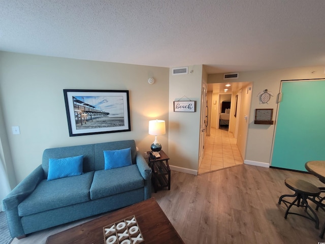 201 S Ocean Blvd Unit 205, Myrtle Beach, SC 29577 - living room with wood finished floors and a textured ceiling