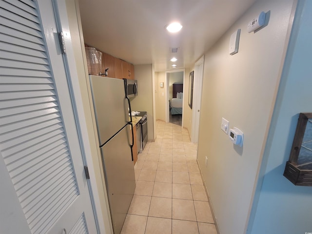 201 S Ocean Blvd Unit 205, Myrtle Beach, SC 29577 - corridor with light tile patterned floors and recessed lighting