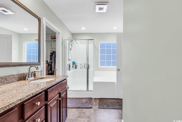 209 Haley Brooke Dr, Conway, SC 29526 - bathroom featuring a stall shower, a spacious closet, vanity, a bath, and plenty of natural light