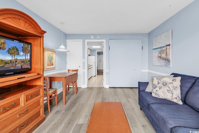 2300 N Ocean Blvd Unit 132, Myrtle Beach, SC 29577 - living room with light wood-type flooring and baseboards