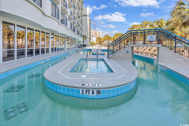 2300 N Ocean Blvd Unit 132, Myrtle Beach, SC 29577 - community pool featuring a community hot tub and stairs