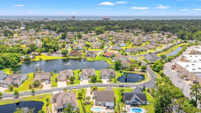 1715 Lake Egret Dr, North Myrtle Beach, SC 29582 - aerial perspective of suburban area with a nearby body of water