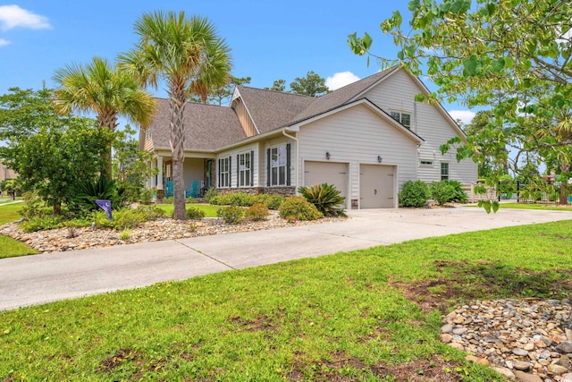1715 Lake Egret Dr, North Myrtle Beach, SC 29582 - view of front of home featuring concrete driveway, a front yard, an attached garage, and a shingled roof