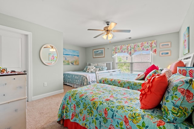 1715 Lake Egret Dr, North Myrtle Beach, SC 29582 - carpeted bedroom with baseboards and a ceiling fan