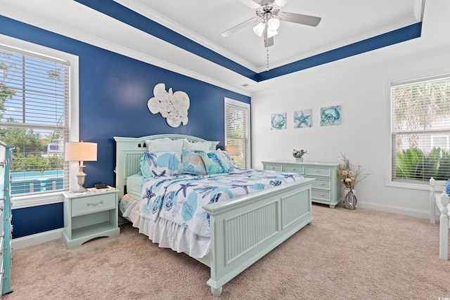 1715 Lake Egret Dr, North Myrtle Beach, SC 29582 - bedroom featuring light carpet, a tray ceiling, ornamental molding, and a ceiling fan