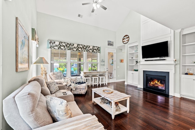 1715 Lake Egret Dr, North Myrtle Beach, SC 29582 - living room with high vaulted ceiling, a ceiling fan, hardwood / wood-style flooring, a fireplace with flush hearth, and built in shelves