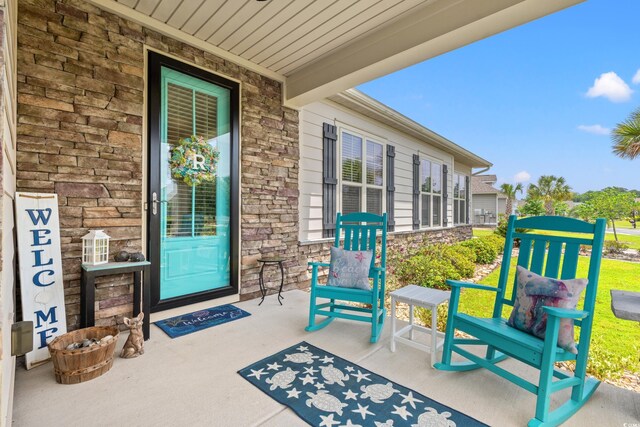 1715 Lake Egret Dr, North Myrtle Beach, SC 29582 - view of exterior entry with stone siding